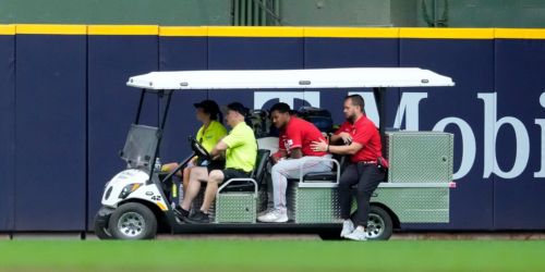 Myers carted off after spectacular grab, running into wall in CF