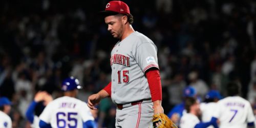 Minutes after game-saving catch that wasn't, Reds suffer heartbreaking loss