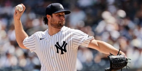 Cole finds vintage form with 11 K's, but Yanks' bats silenced in extras