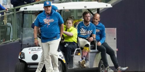 Brewers' Lockridge carted off, suffers laceration after slamming knee into wall