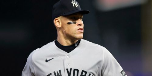 Judge held out of starting lineup day after Yanks clinch spot in playoff field