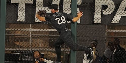 Peters (shoulder/rib) day to day after running full speed into outfield wall