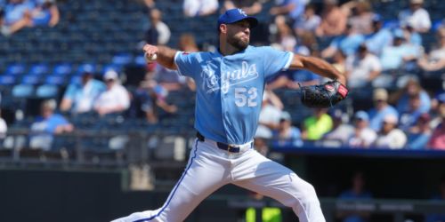 Wacha provides relief for Royals' 'pen, but efforts fall short after long rain delay