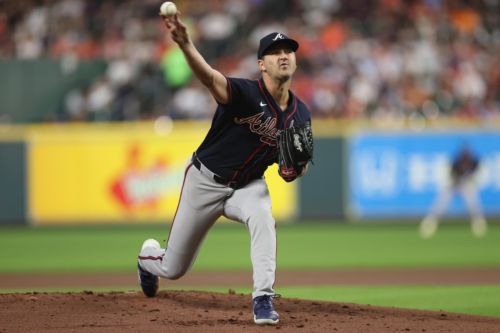 Braves clinch postseason bid with three homers in win over Astros
