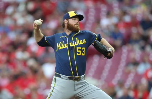 Woodruff shines in return as Brewers eke out 2-1 win in extras