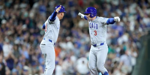 Bregman homers twice, but Cubs fall in extras