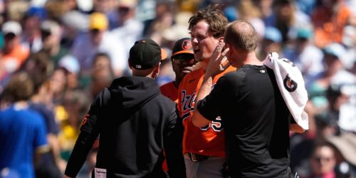 Rutschman exits game after being hit by throw on left ear
