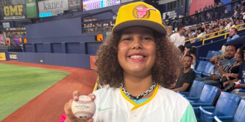 Kid in Tatis jersey catches home run ball, gets fist bump from his favorite player